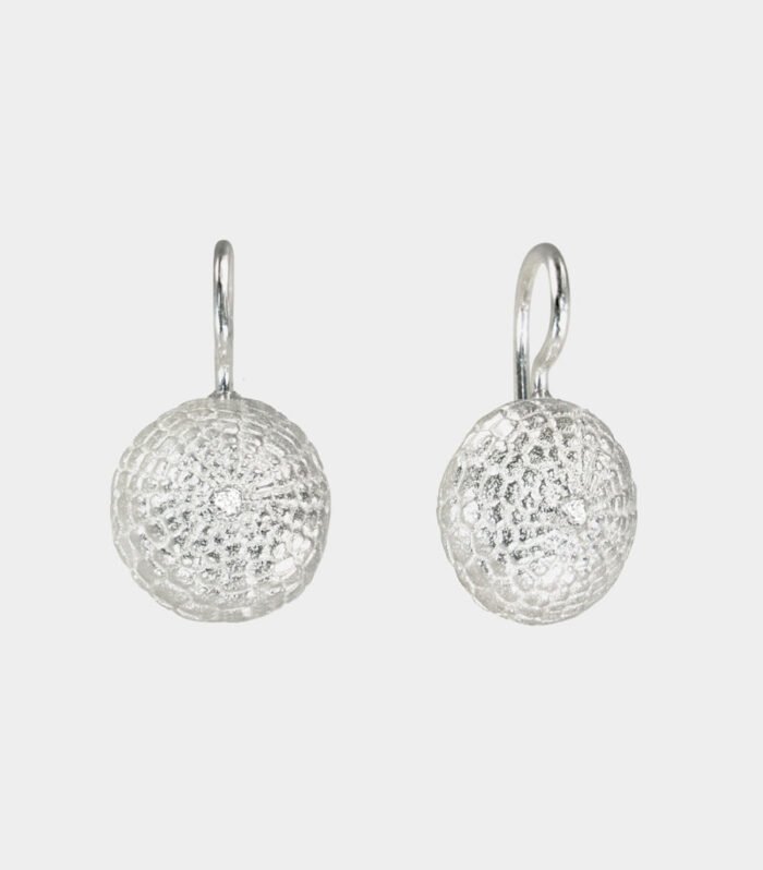 silver turtle sea urchin with white topaz